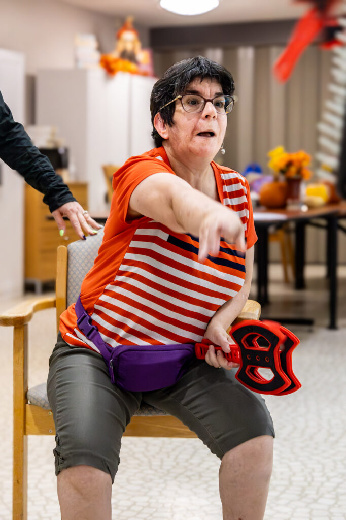 9451 Enhanced NR Woman Throwing  Ax  Adult Day Program